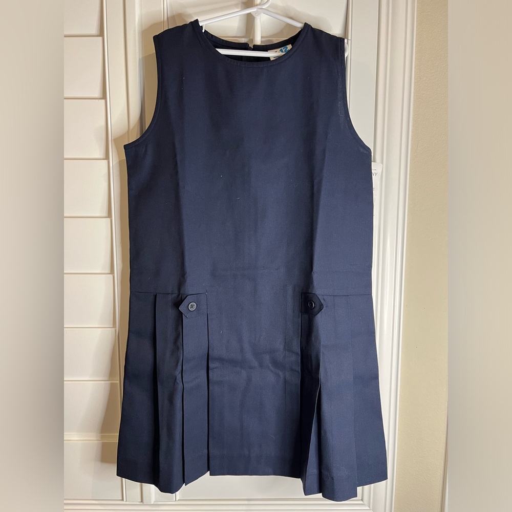 Sleeveless navy school uniform dress.